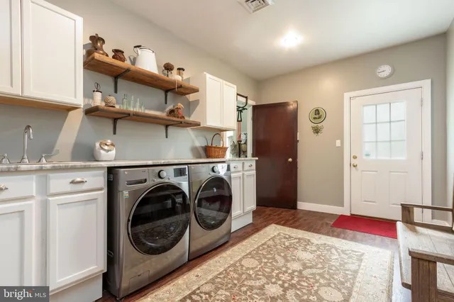 a view of a kitchen with washer and dryer