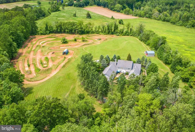 a view of a swimming pool with an outdoor space and seating area