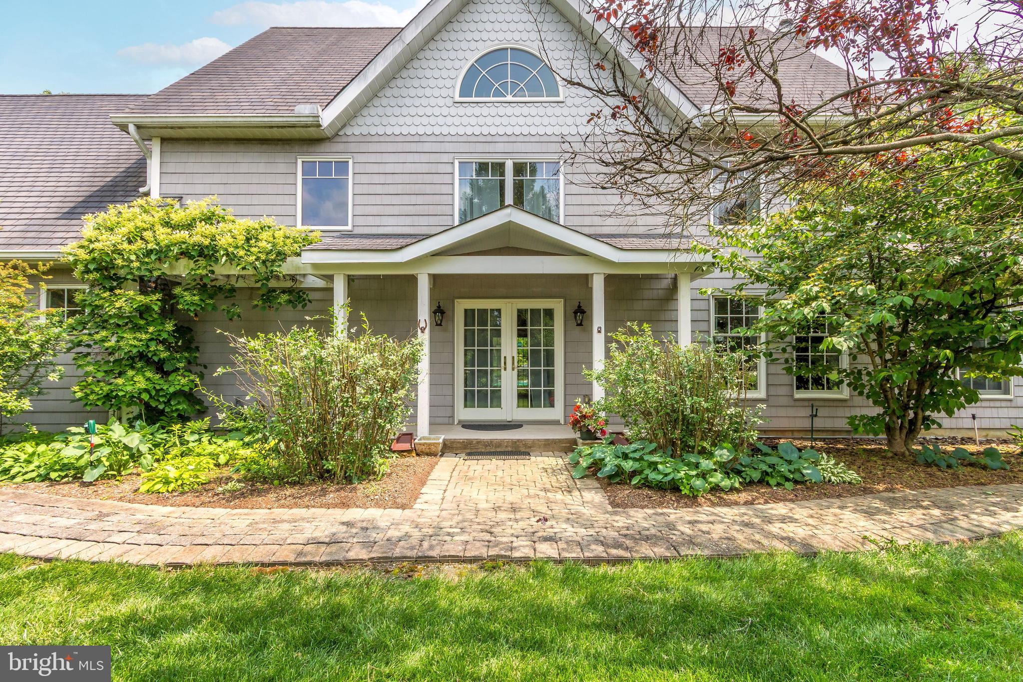 80 Linvale Road Ringoes, NJ 08551 - Photo 9 of 47 a front view of a house with garden