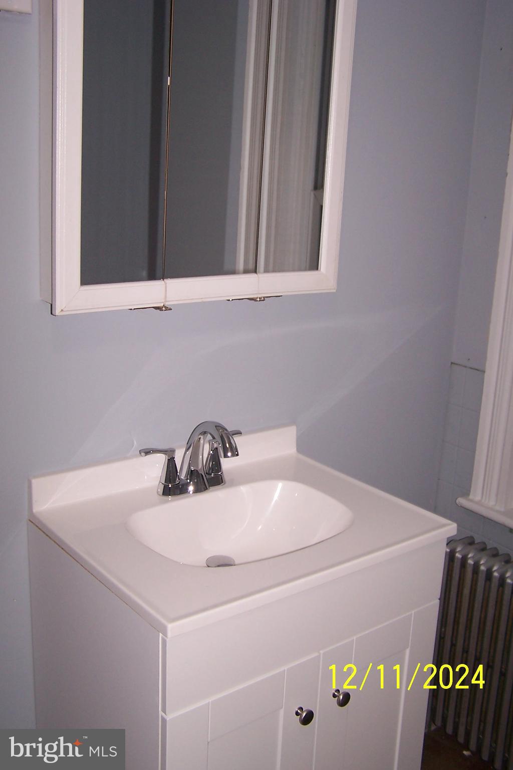 303 West Patterson Street Lansford, PA 18232 - Photo 16 of 22 a bathroom with a sink and a vanity