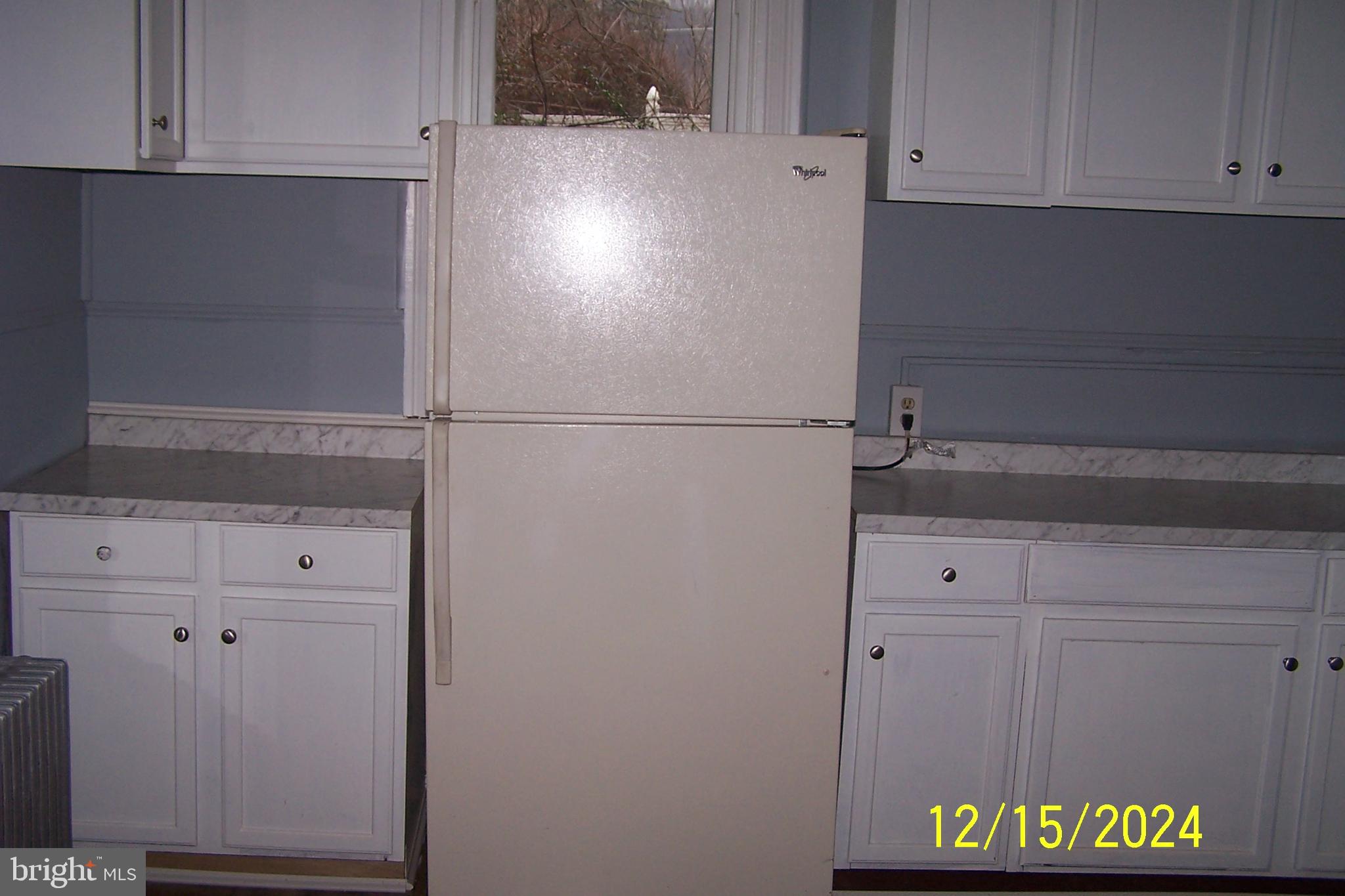 303 West Patterson Street Lansford, PA 18232 - Photo 7 of 22 a white refrigerator freezer sitting inside of a kitchen