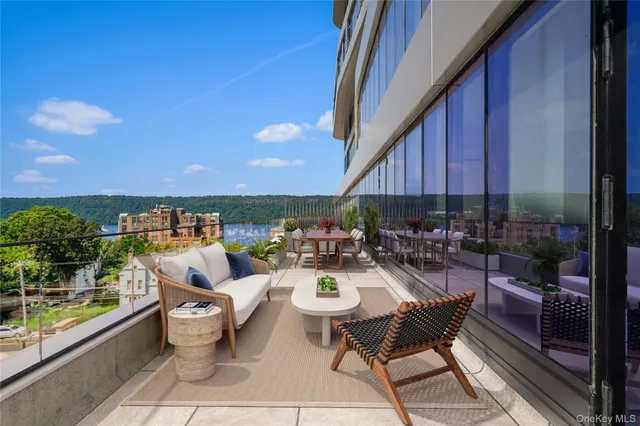 a view of a patio with a dining table and chairs