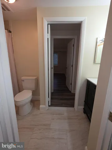 a bathroom with a toilet and a sink