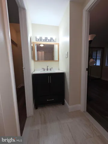 a bathroom with a double vanity sink and mirror