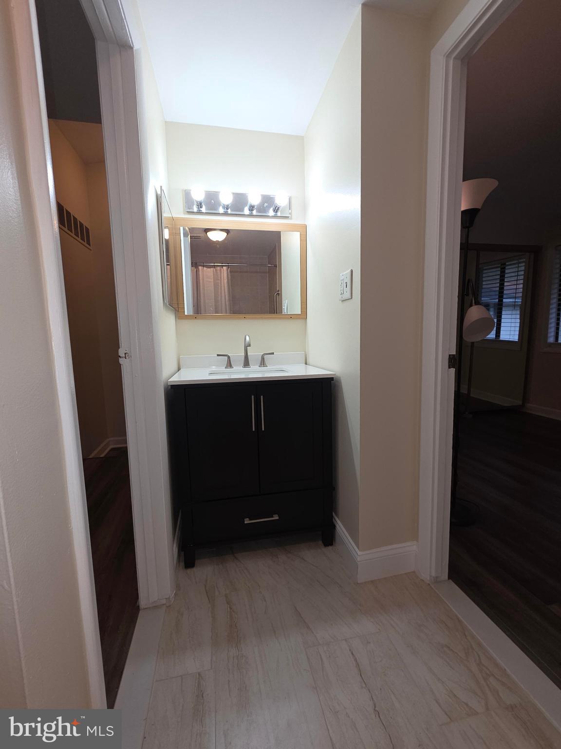 5407 Fallriver Row Court Columbia, MD 21044 - Photo 18 of 36 a bathroom with a double vanity sink and mirror