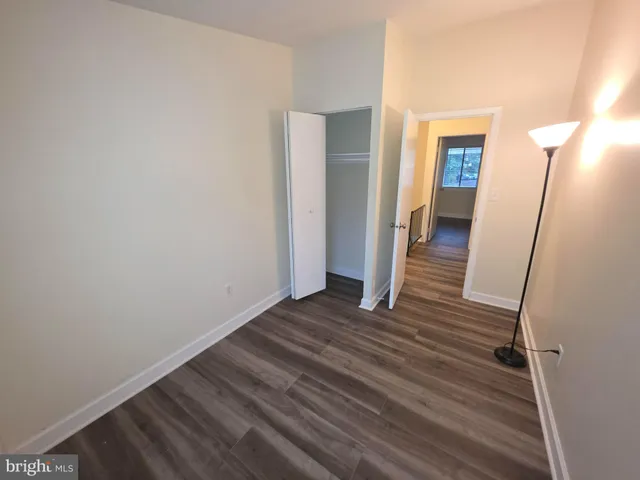 a view of a room with wooden floor and staircase