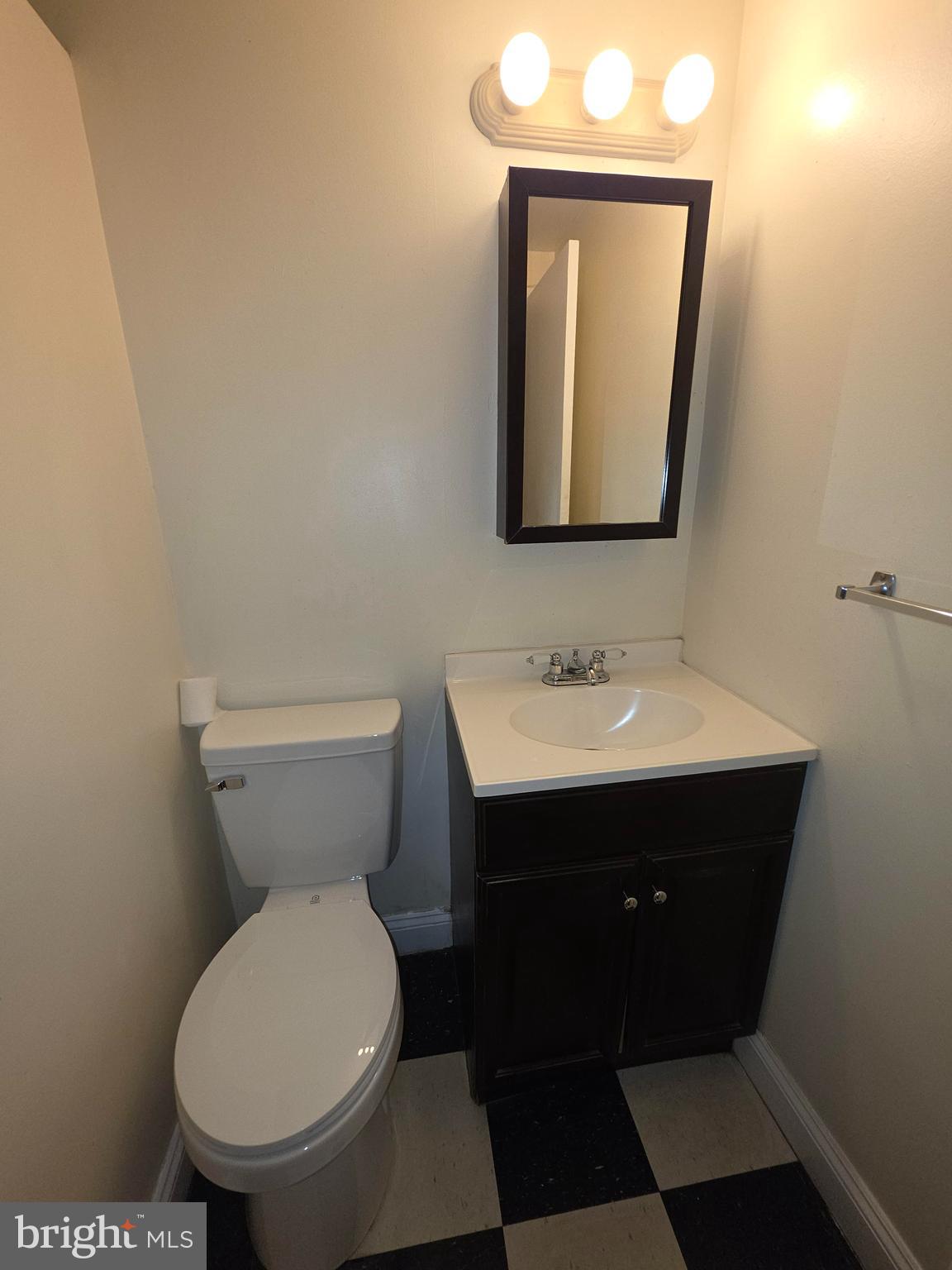 5407 Fallriver Row Court Columbia, MD 21044 - Photo 32 of 36 a bathroom with a toilet sink and mirror