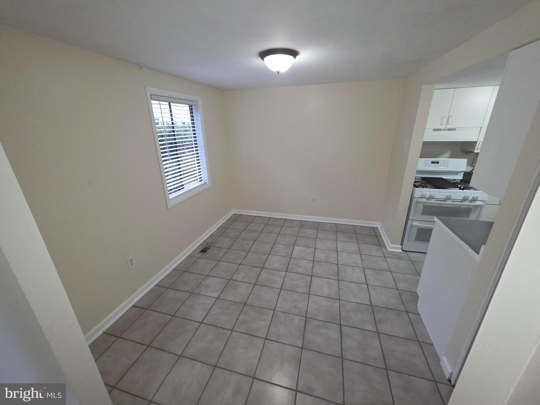 5407 Fallriver Row Court Columbia, MD 21044 - Photo 4 of 36 a view of an empty room with a window