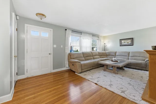 a living room with a couch and a window
