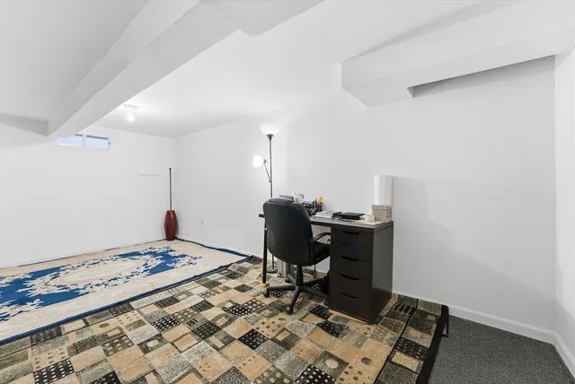 a workspace with furniture and wooden floor