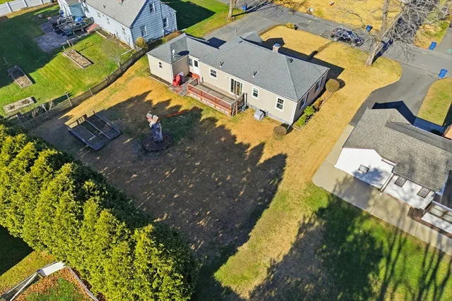 an aerial view of residential houses with outdoor space