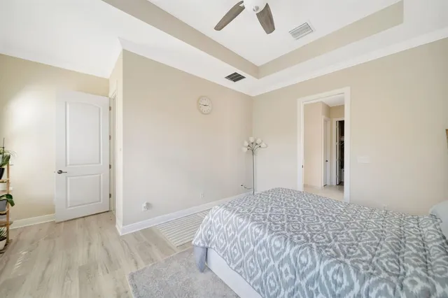 a bedroom with a bed and a view of bathroom
