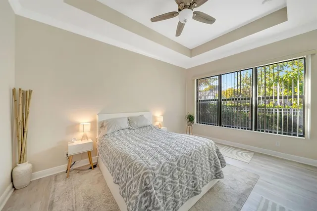 a bedroom with a large bed and a large window