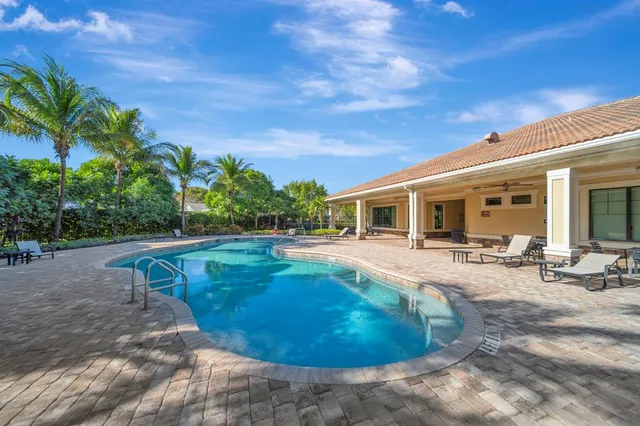 a view of a swimming pool with a patio