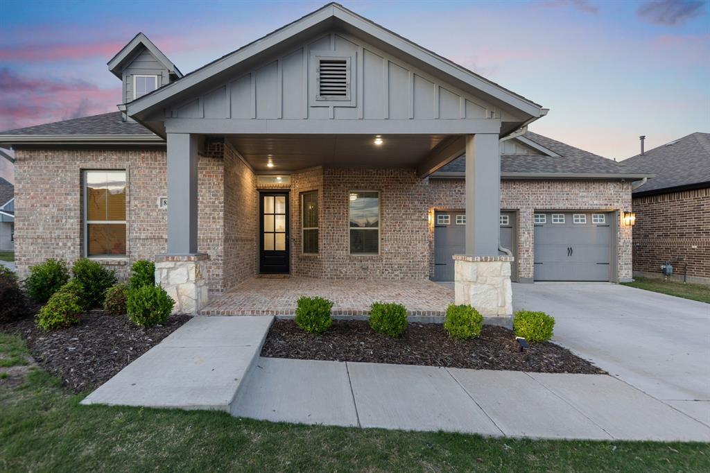 8808 Royal Star Road Rowlett, TX 75089 - Photo 6 of 40 a front view of a house with garden