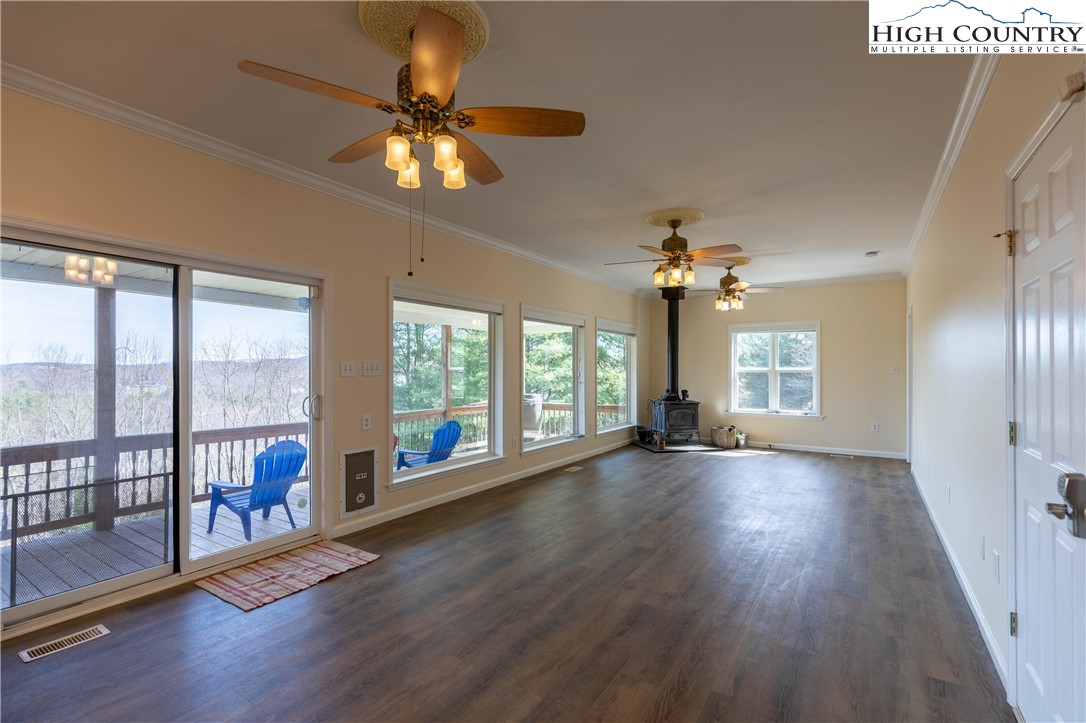 449 Meadow Ridge Drive Jefferson, NC 28640 - Photo 10 of 37 a view of an empty room with wooden floor and a window