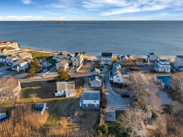 an aerial view of a house with a lake view