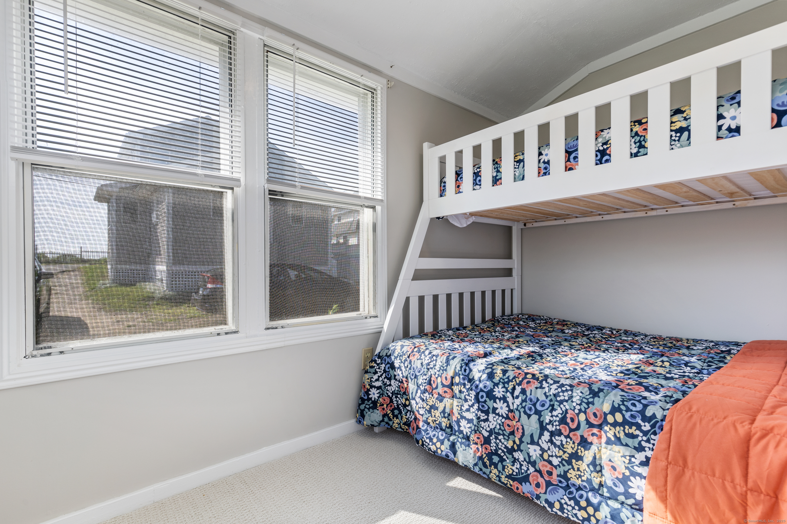 176 Shore Road, Unit B Clinton, CT 06413 - Photo 21 of 24 a bedroom with a bed and a window