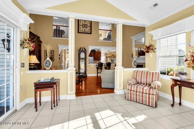 a bathroom with a granite countertop double vanity sink and a mirror