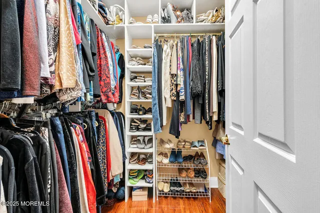 a view of a livingroom with furniture and a flat screen tv