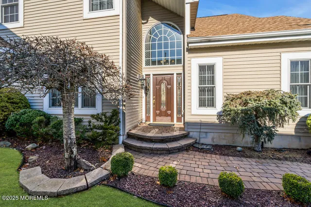 a front view of a house with a yard