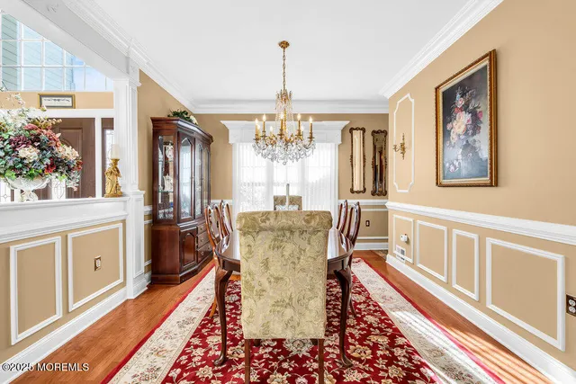 a dining room with furniture a livingroom and chandelier