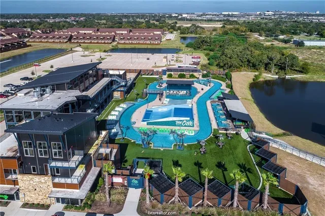 an aerial view of a house with a lake view