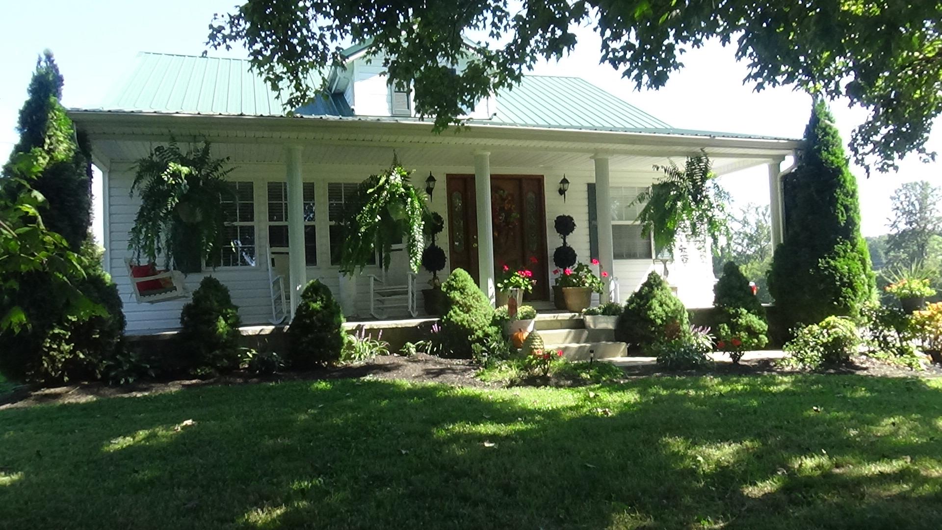 1126 Maxwell Branch Road Cottontown, TN 37048 - Photo 1 of 27 front view of a house with a yard