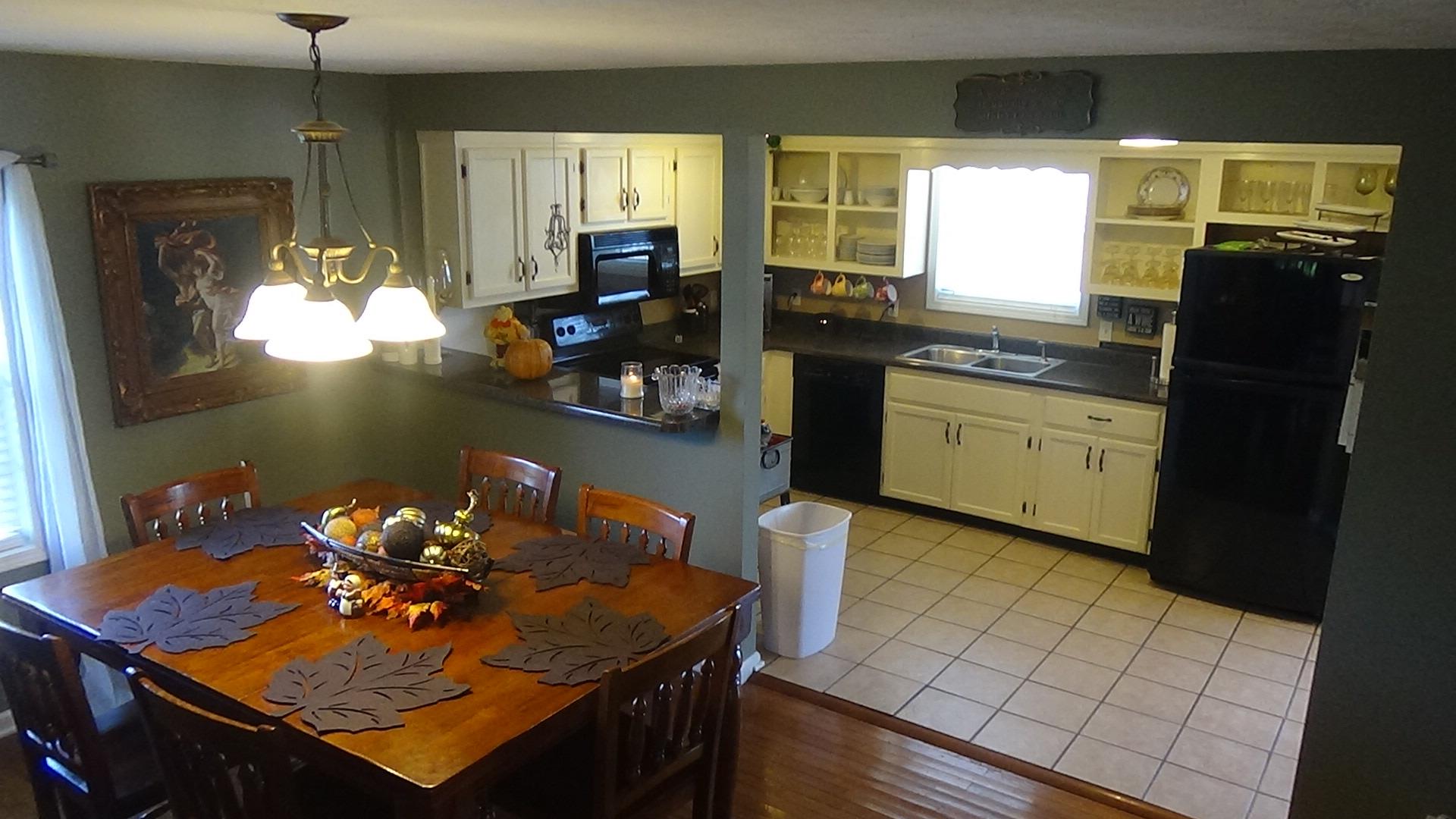 1126 Maxwell Branch Road Cottontown, TN 37048 - Photo 11 of 27 a kitchen with a sink appliances and cabinets