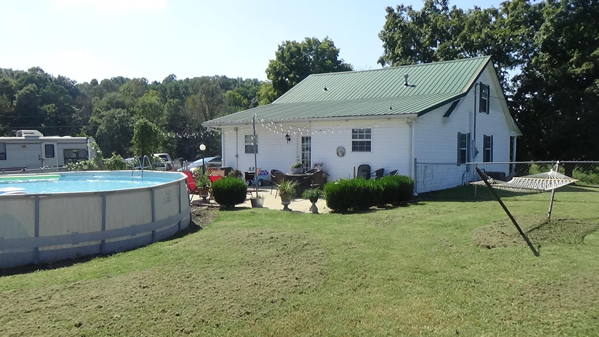 1126 Maxwell Branch Road Cottontown, TN 37048 - Photo 24 of 27 a view of a house with backyard and sitting area
