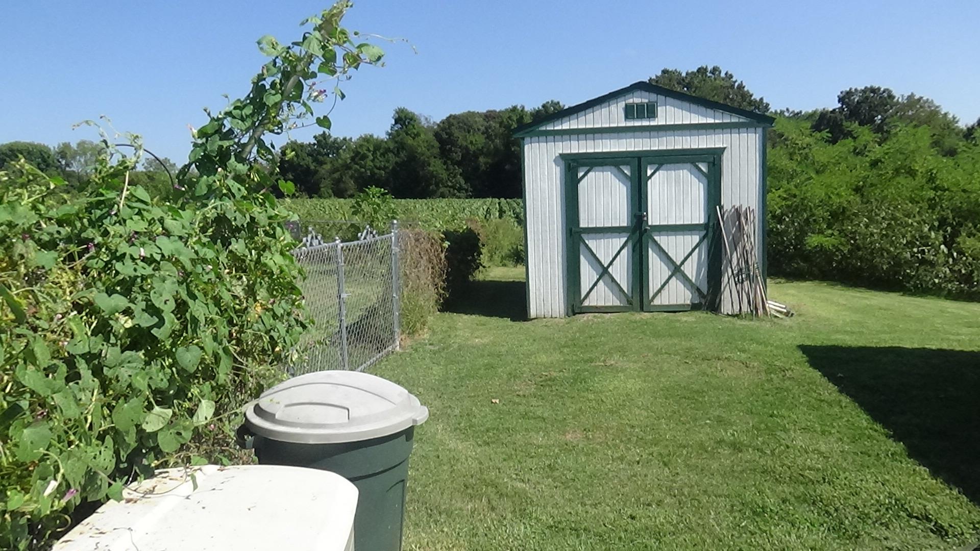 1126 Maxwell Branch Road Cottontown, TN 37048 - Photo 27 of 27 a view of a wooden door and a small yard