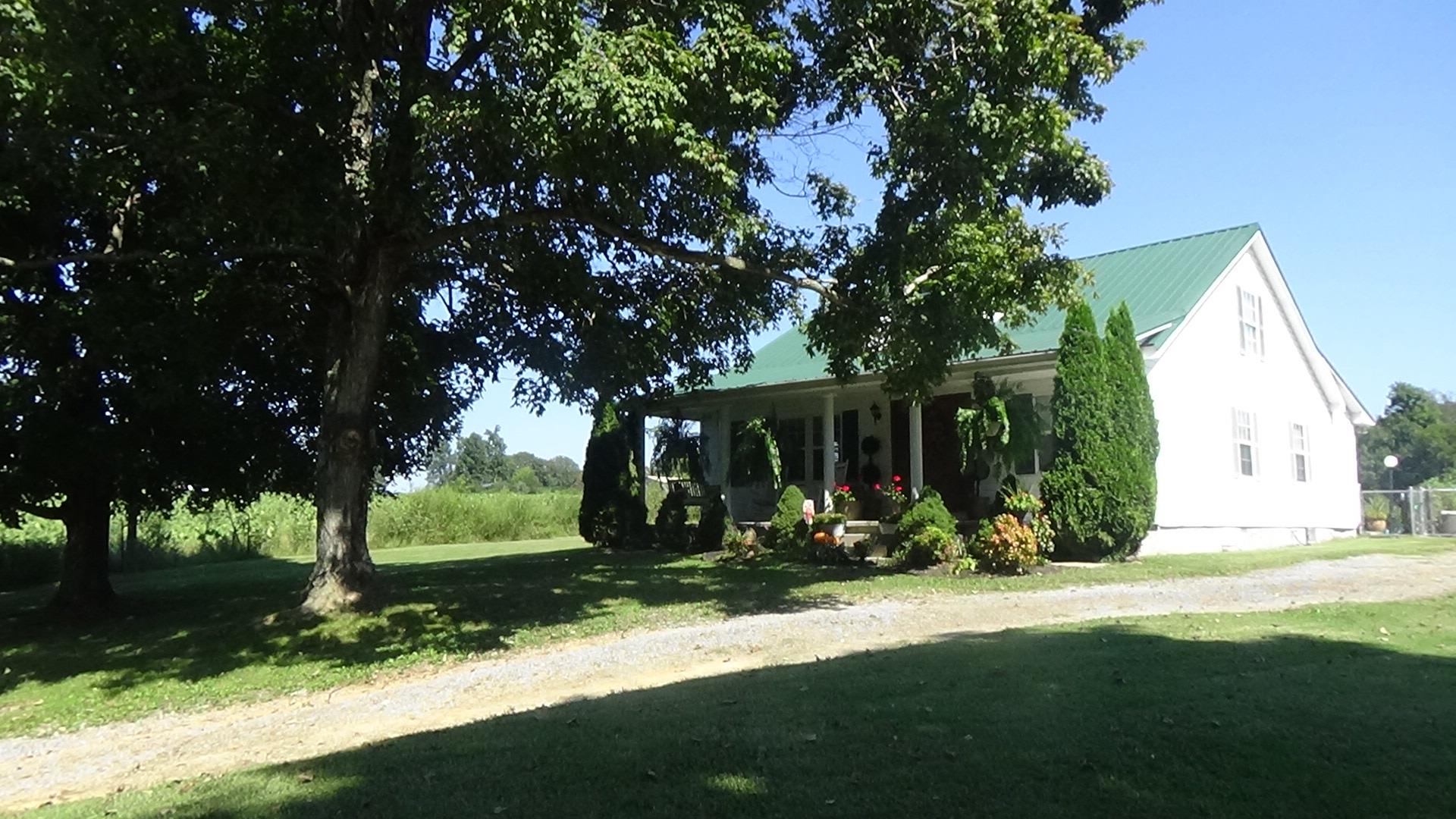 1126 Maxwell Branch Road Cottontown, TN 37048 - Photo 5 of 27 a view of a house with a tree in front of it