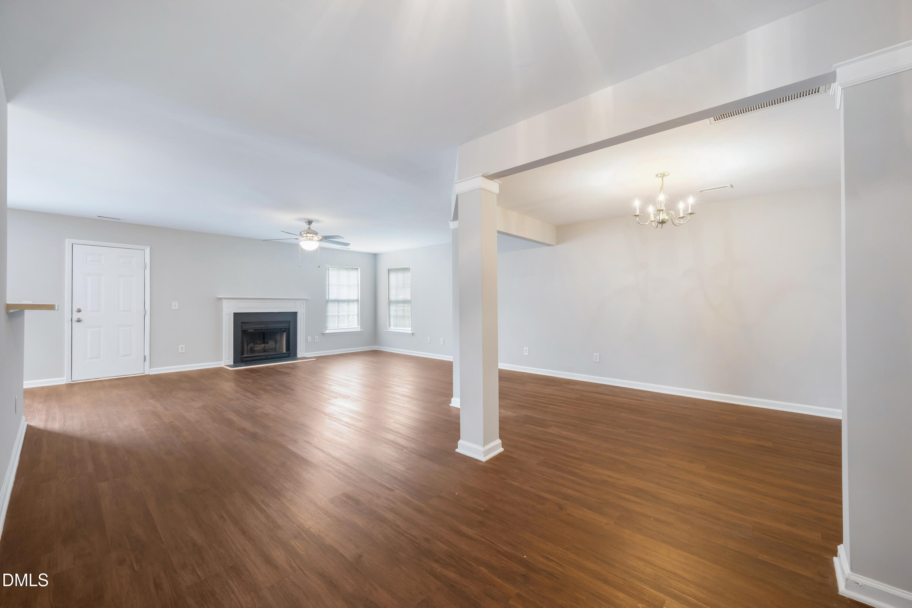 1532 Pebble Ridge Drive Raleigh, NC 27610 - Photo 7 of 40 a view of empty room with wooden floor and fireplace