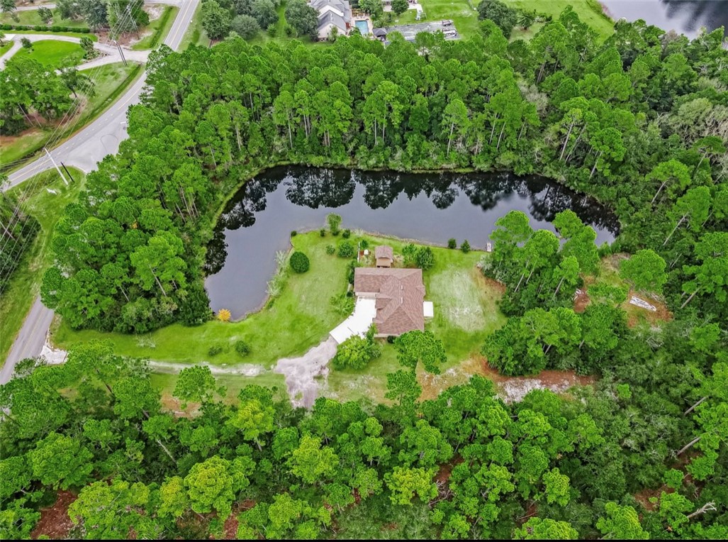 96372 Green Pine Road Yulee, FL 32097 - Photo 26 of 28 an aerial view of residential house with outdoor space and trees all around