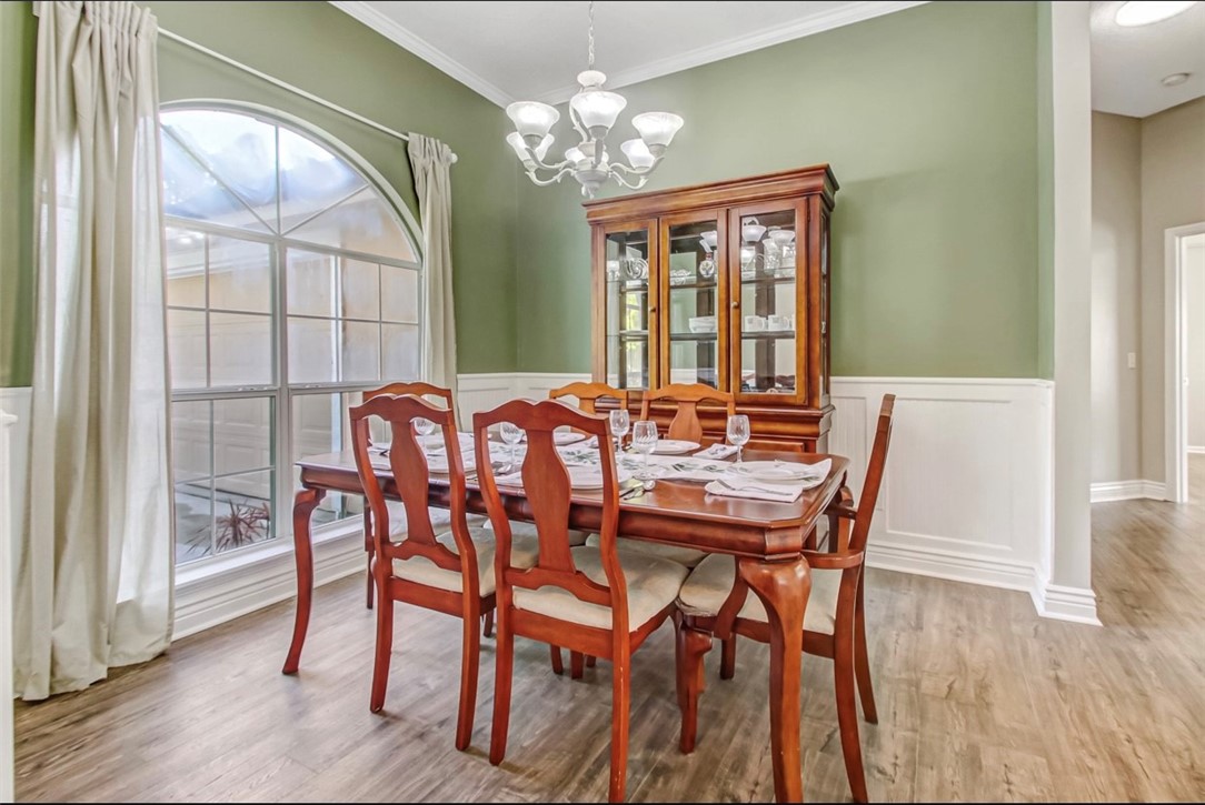 96372 Green Pine Road Yulee, FL 32097 - Photo 4 of 28 a view of a dining room with furniture window and wooden floor