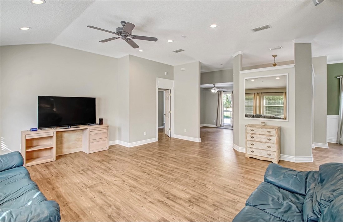 96372 Green Pine Road Yulee, FL 32097 - Photo 8 of 28 a living room with furniture and a flat screen tv