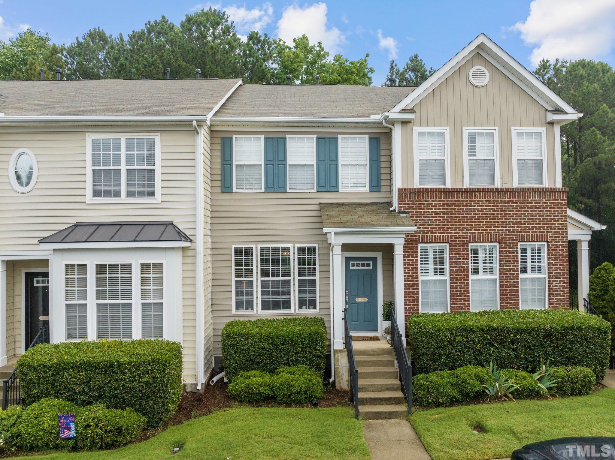 7882 Spungold Street Raleigh, NC 27617 - Photo 1 of 27 a front view of a house with a yard