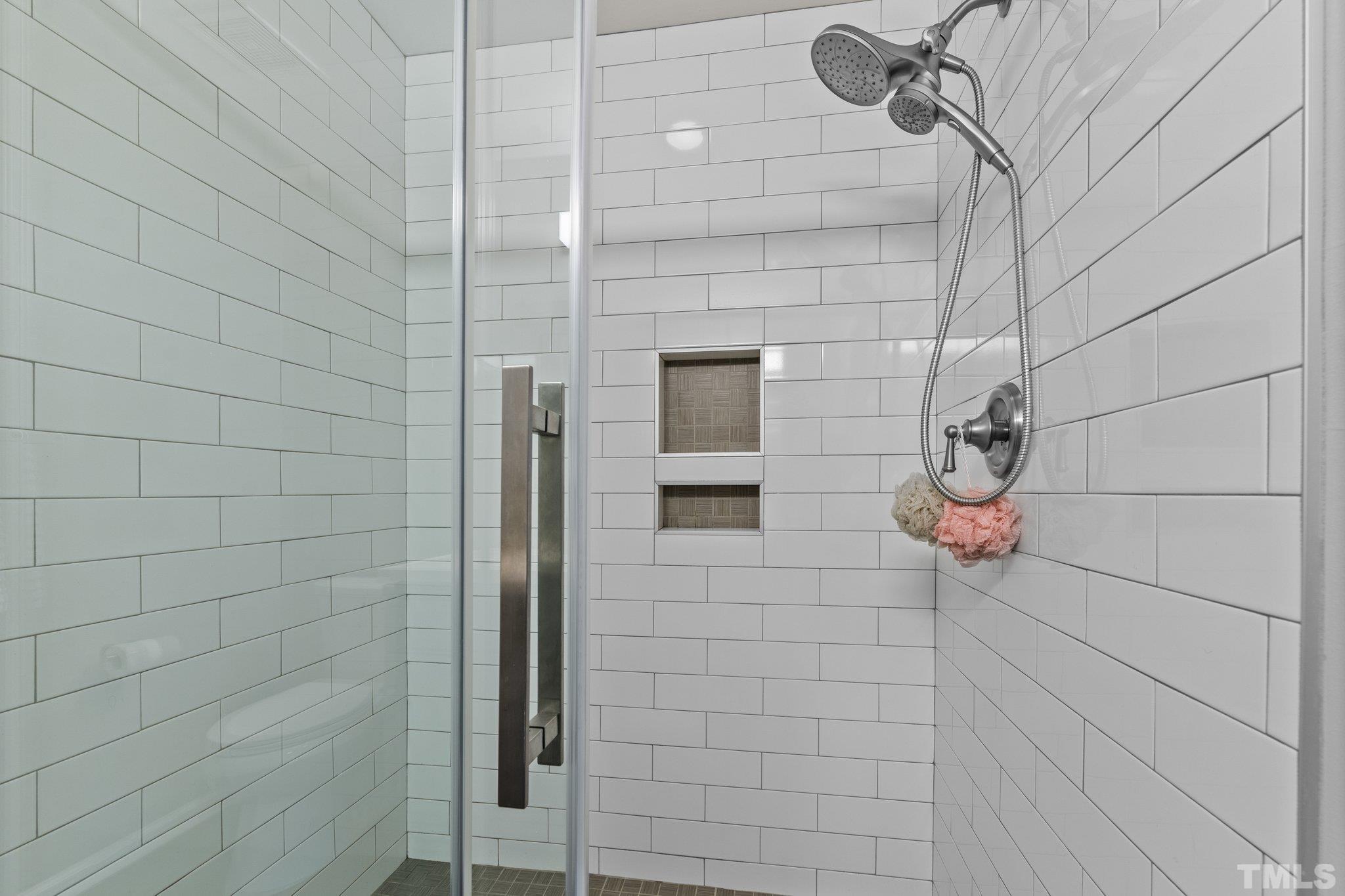 7882 Spungold Street Raleigh, NC 27617 - Photo 13 of 27 a bathroom with a shower