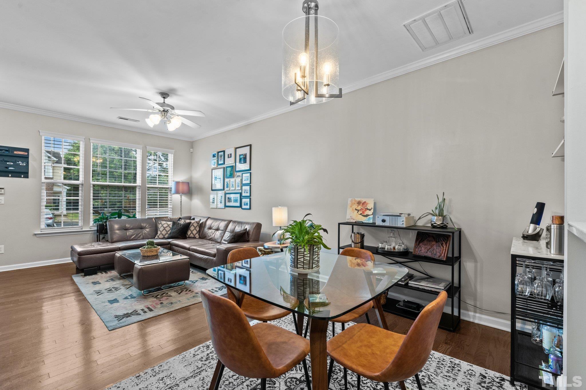 7882 Spungold Street Raleigh, NC 27617 - Photo 6 of 27 a view of a dining room with furniture window and outside view