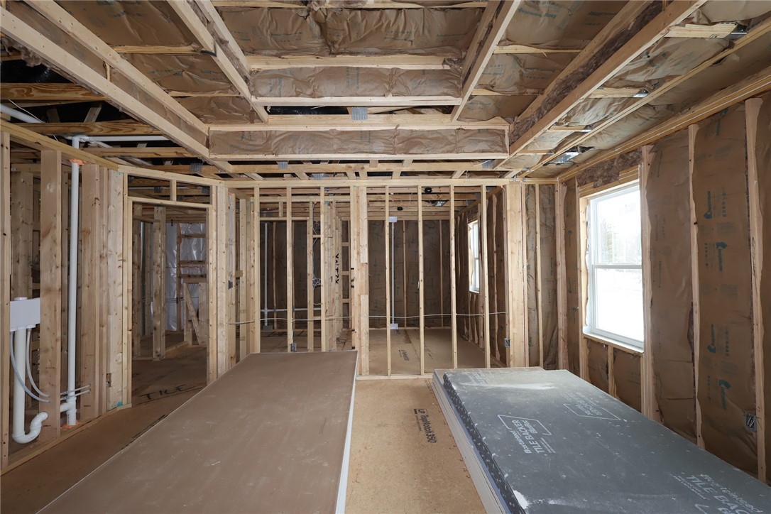 240 Tilly Court, Unit 5 Springboro, OH 45066 - Photo 6 of 26 This interior captures the early stages of a home's construction, revealing its structural framework.