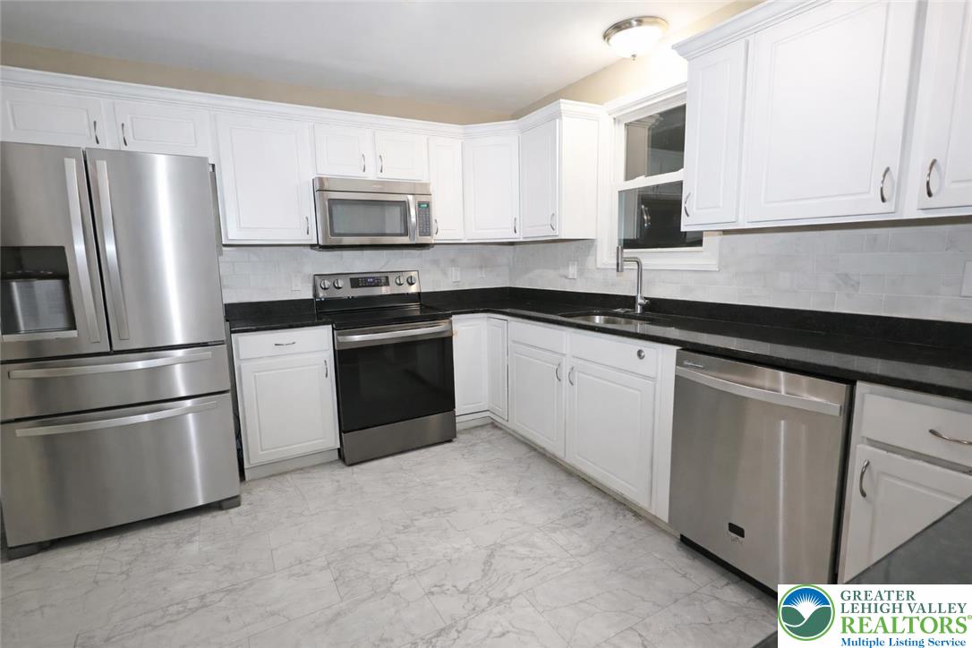 1385 Macada Road Bethlehem, PA 18017 - Photo 4 of 14 Kitchen with granite and stainless appliances