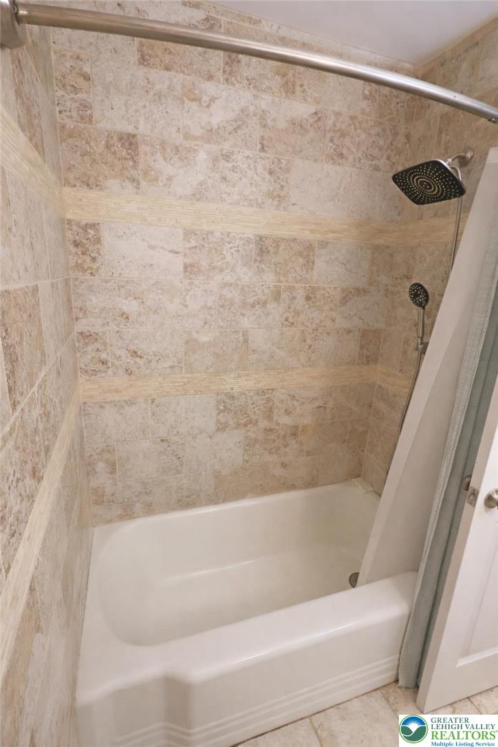 1385 Macada Road Bethlehem, PA 18017 - Photo 10 of 14 Full bathroom tub with decorative tile surround