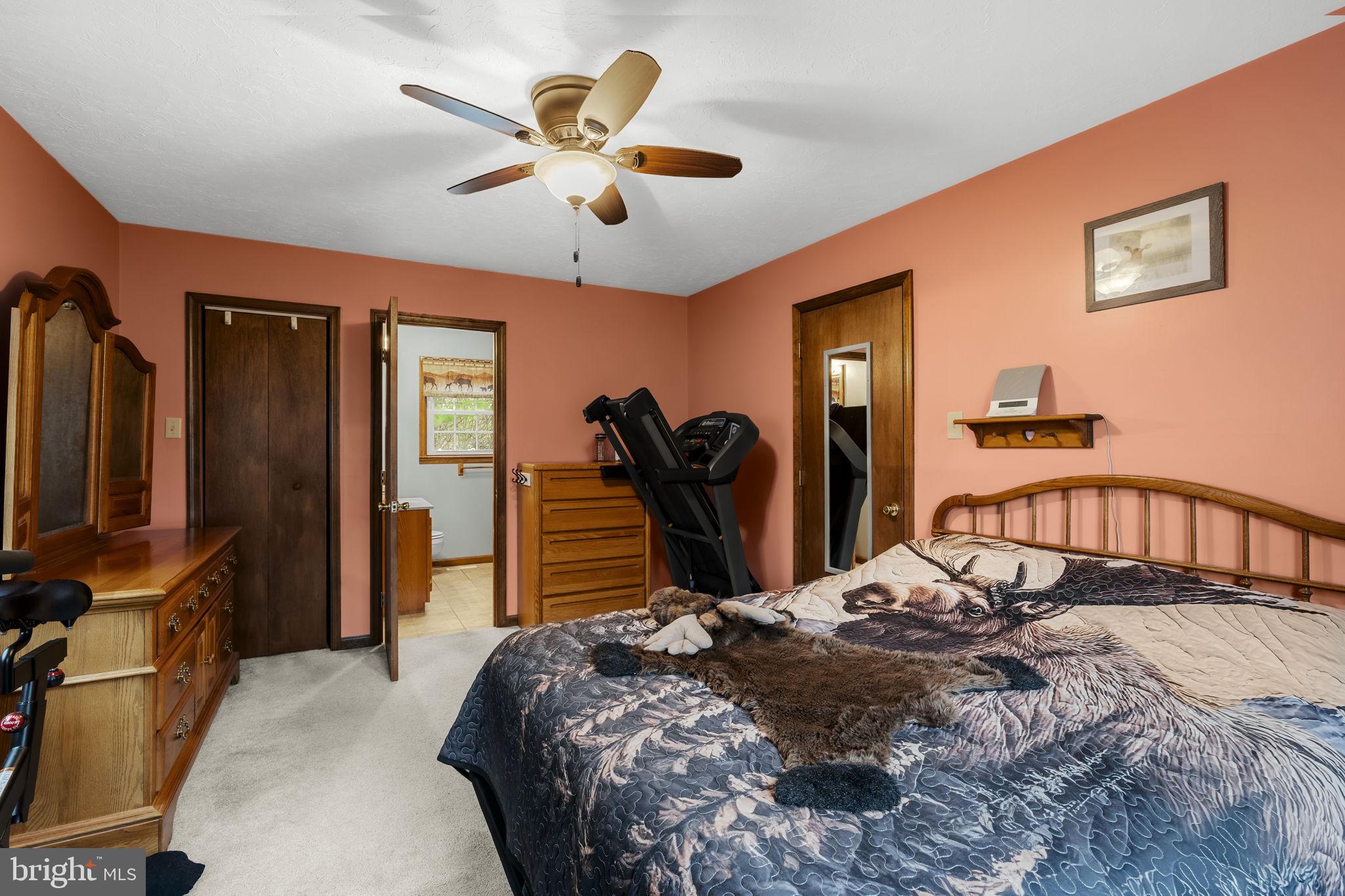 1195 Seglock Road Stevens, PA 17578 - Photo 11 of 33 a bedroom with a bed dresser and a flat tv screen