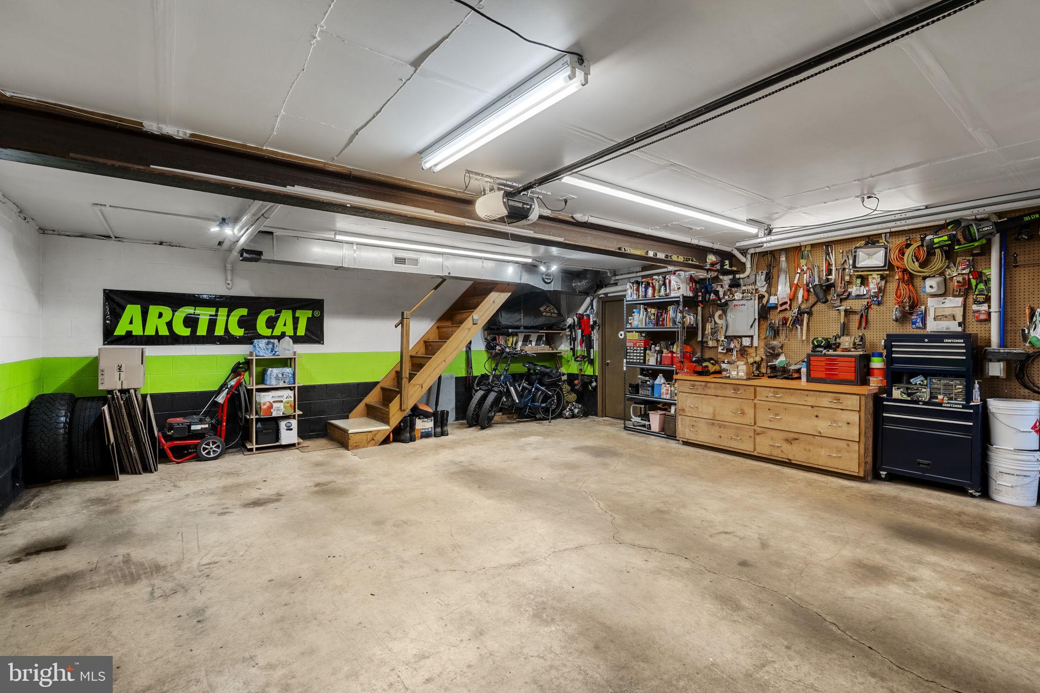 1195 Seglock Road Stevens, PA 17578 - Photo 24 of 33 a view of a garage with a bike and white car