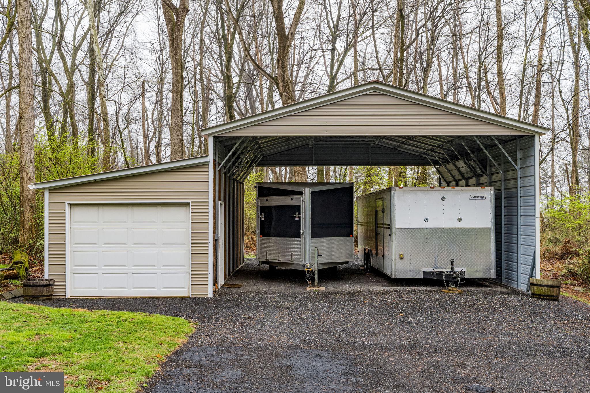 1195 Seglock Road Stevens, PA 17578 - Photo 31 of 33 a front view of a house with a yard and garage