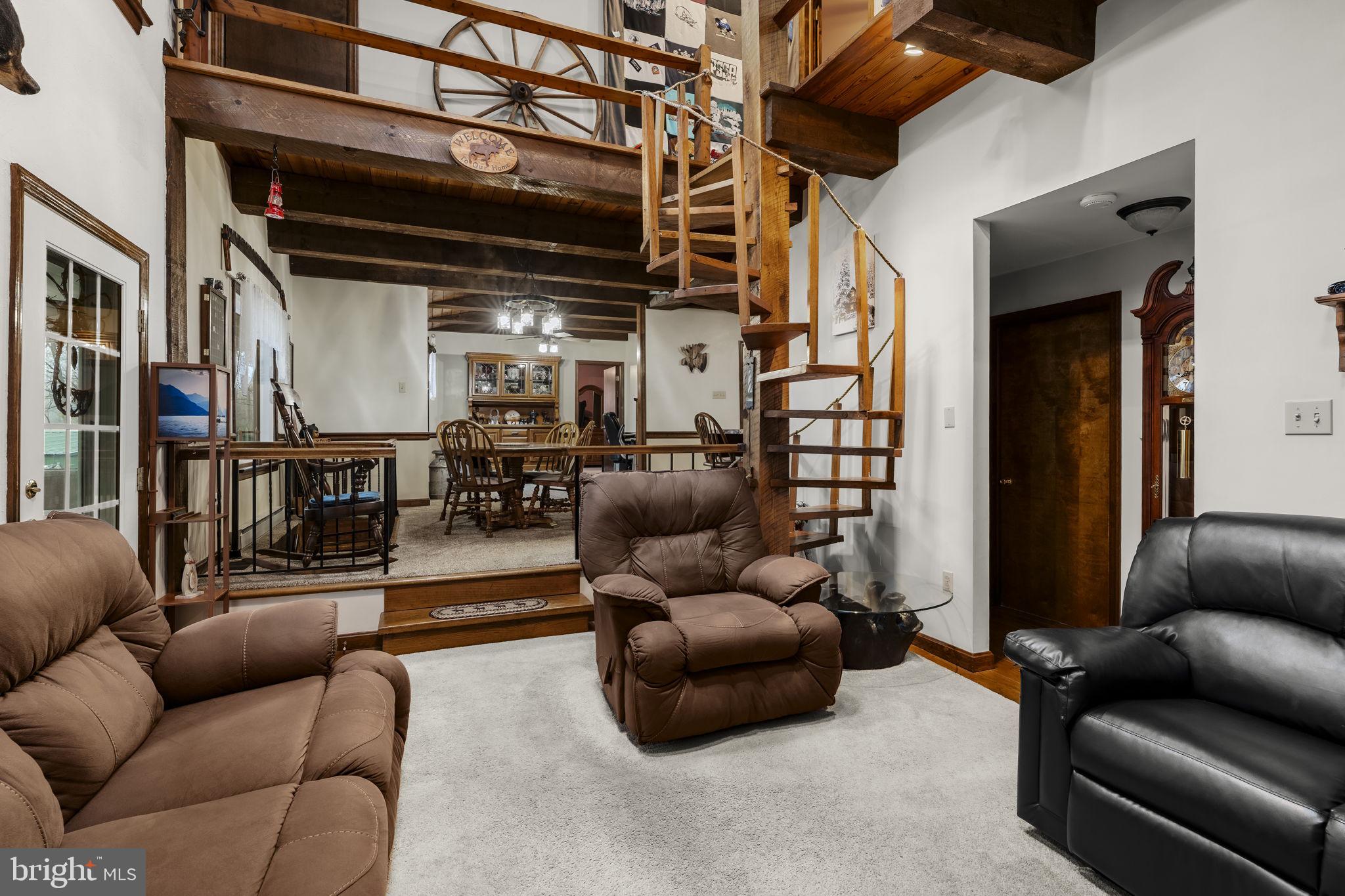 1195 Seglock Road Stevens, PA 17578 - Photo 4 of 33 a living room with furniture or kitchen and a chandelier