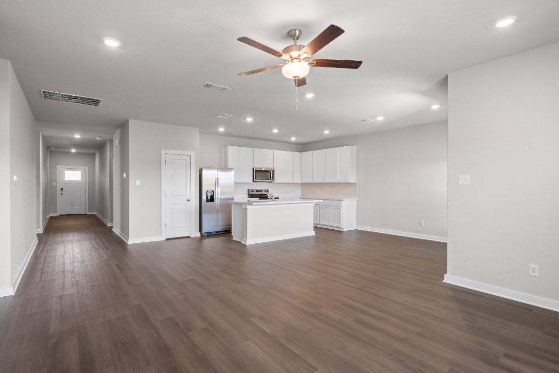 177 Sleep Hollow Jarrell, TX 76537 - Photo 13 of 27 From Family Room to Open Concept Kitchen