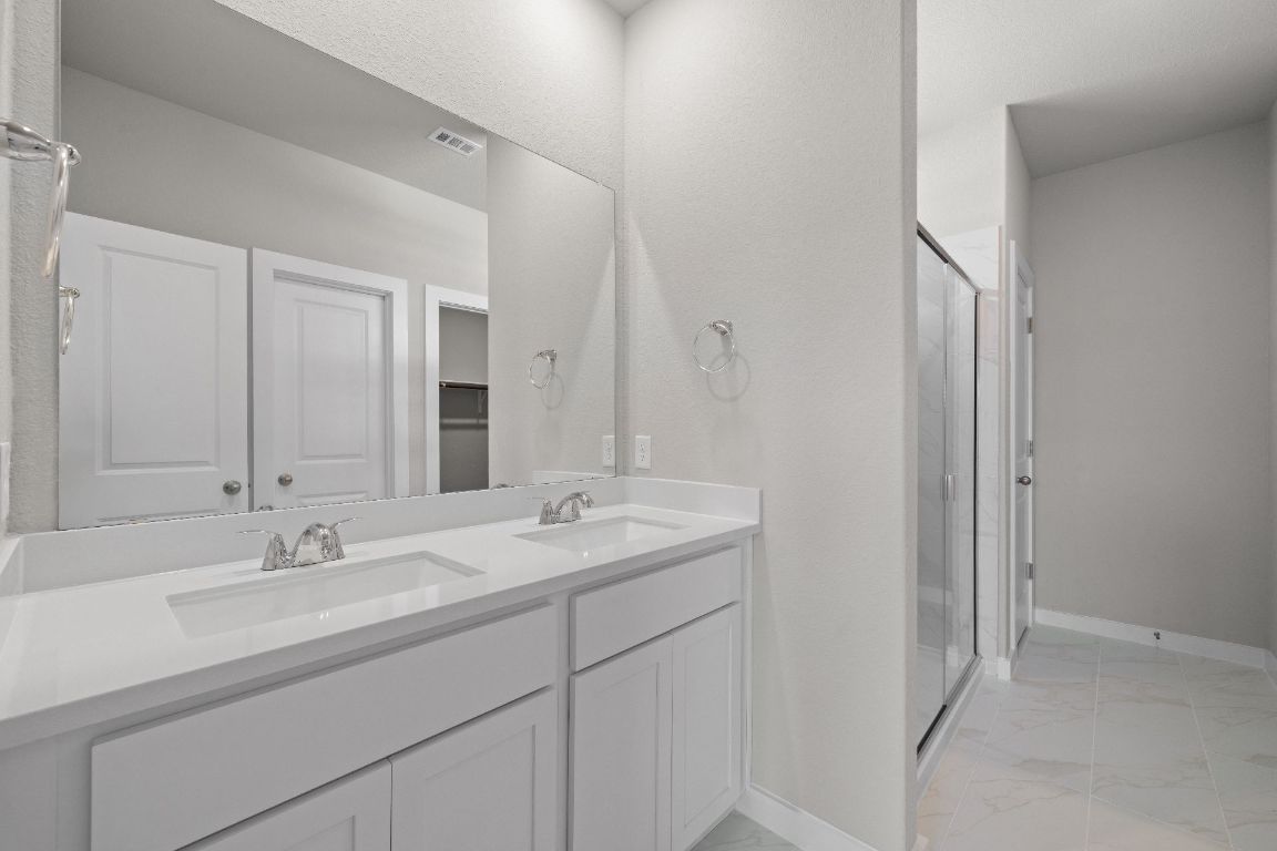 177 Sleep Hollow Jarrell, TX 76537 - Photo 16 of 27 Primary Bath retreat with dual vanities