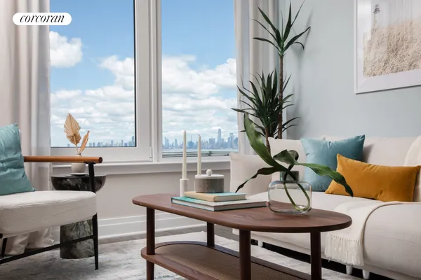 a living room with furniture and a potted plant
