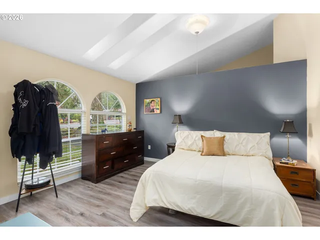 a bedroom with a bed and a closet